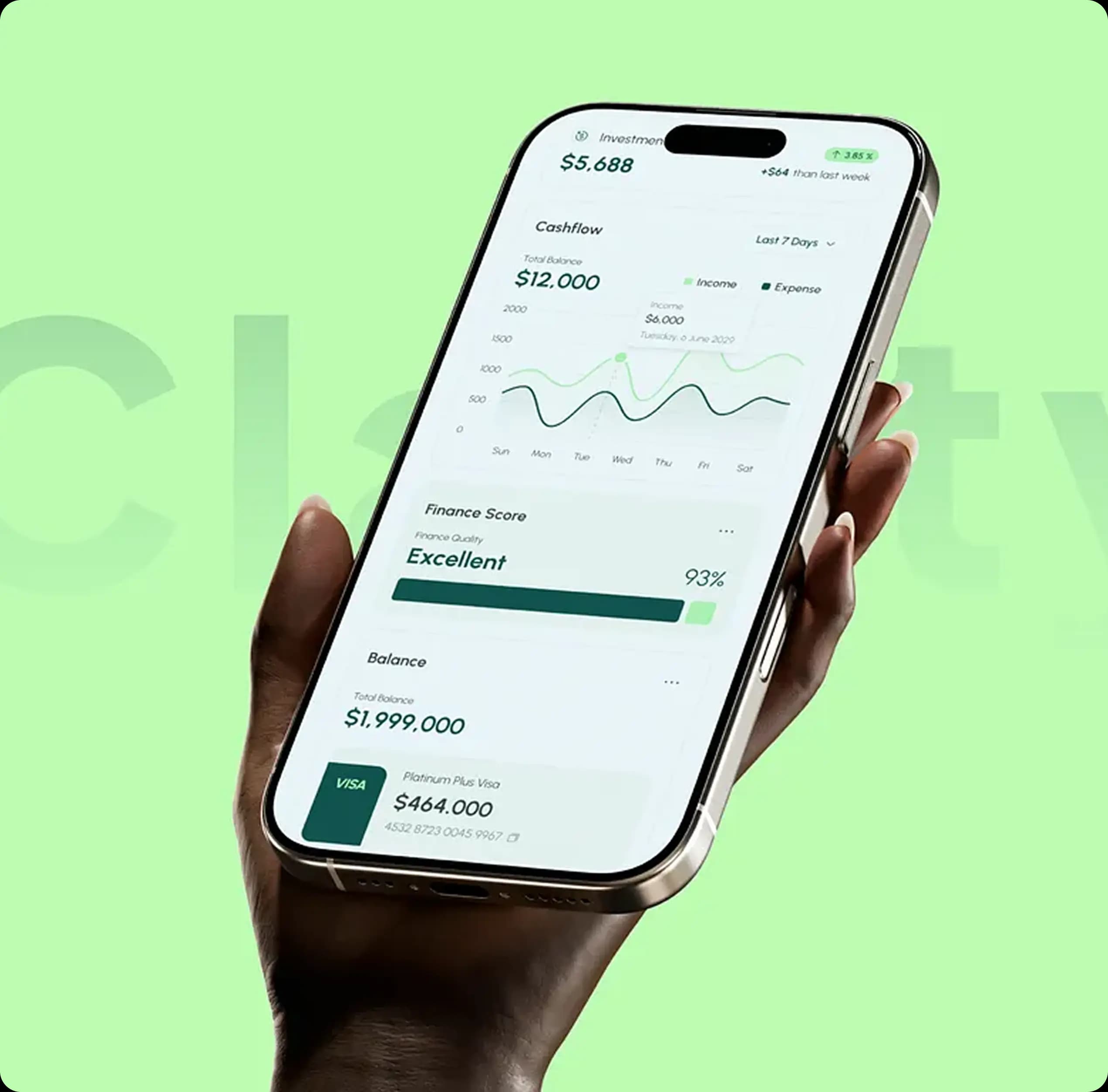 Hand holding smartphone displaying financial app with investment balance and finance charts.