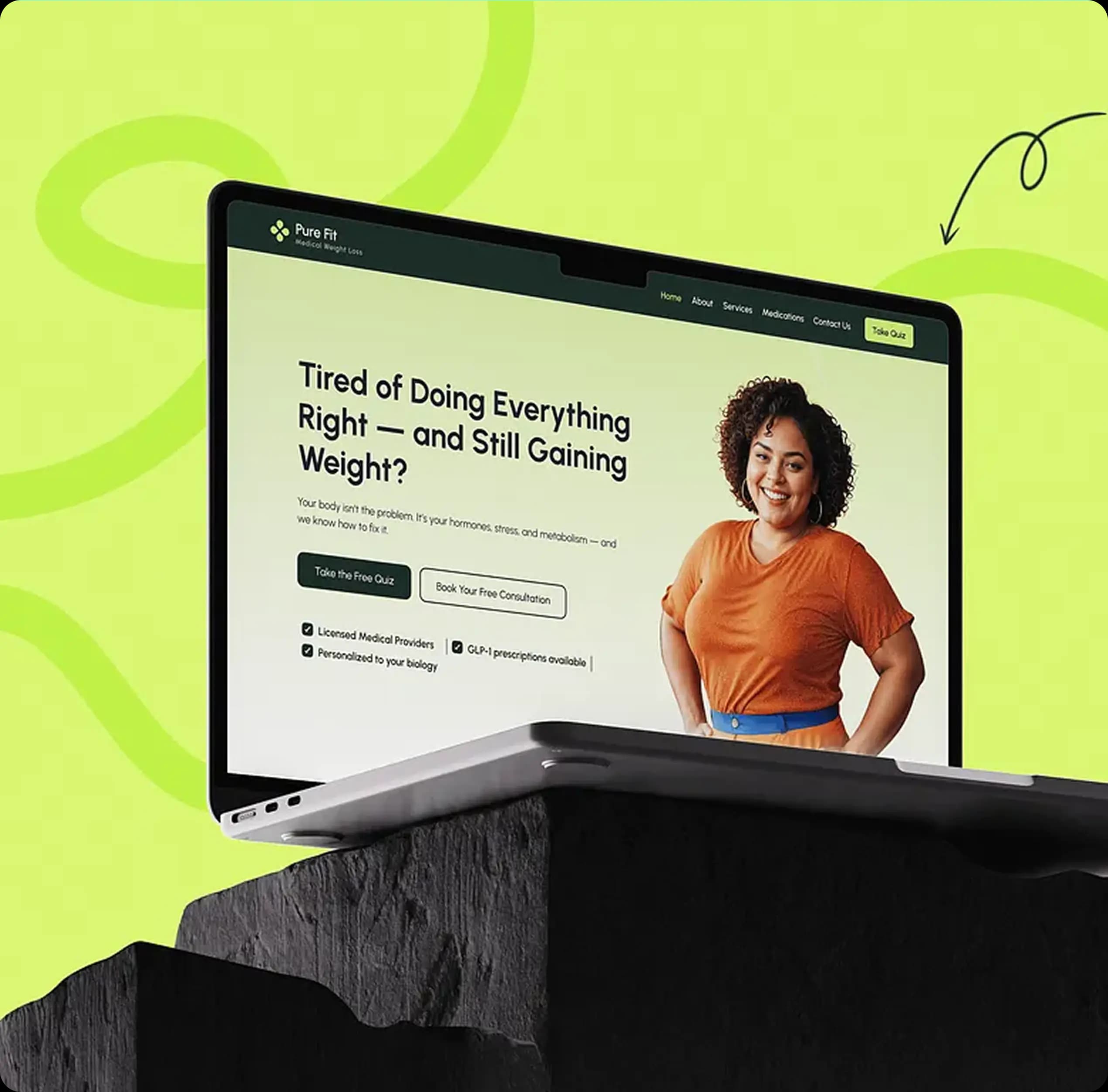 Laptop showing Pure Fit website with fitness and wellness content.